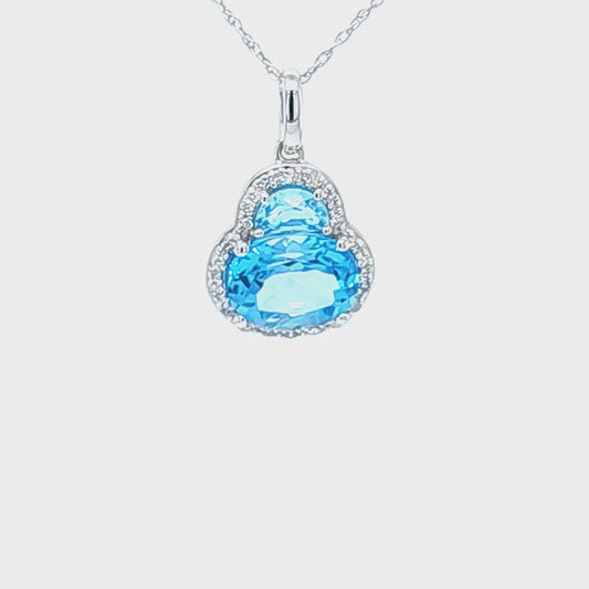 14K White Gold Sky Blue Topaz Pendant With .09ct Total Weight Of Diamonds